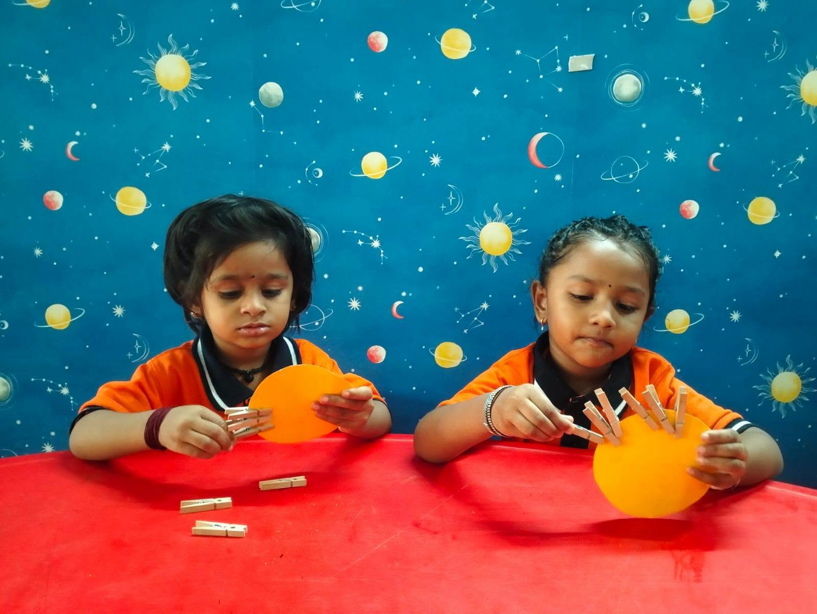 Two children working on a hands-on classroom activity